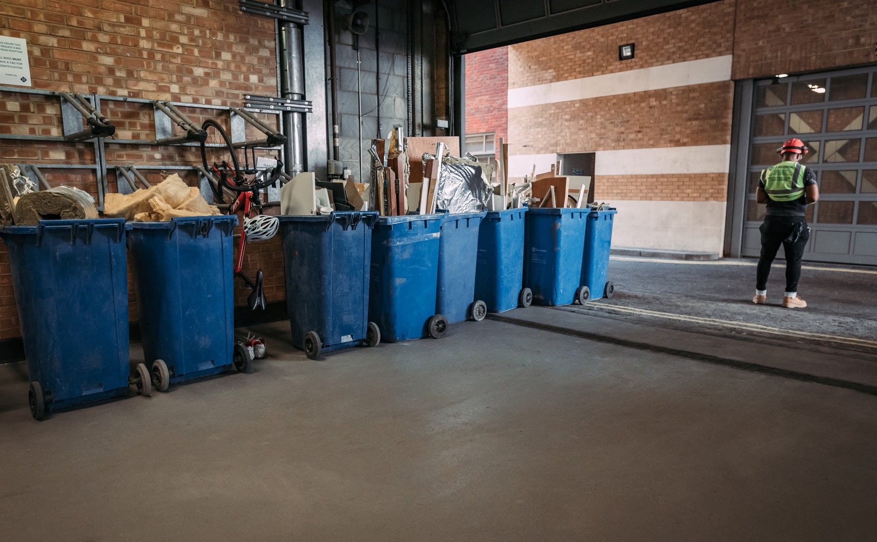 Line of full recycling bins